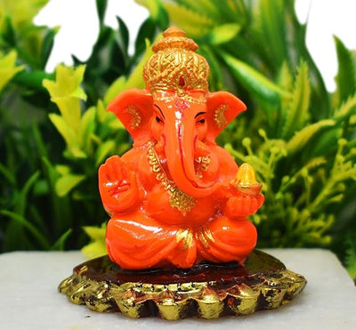 Handmade Lord Ganesh idol for car dashboard and home decor, crafted from resin, measuring 6L x 3.5W x 6.5H cm, symbolizing wisdom and good fortune