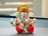 Handmade Lord Ganesh idol for car dashboard and home decor, crafted from resin, measuring 9.4L x 8.4W x 9.6H cm, symbolizing wisdom and prosperity