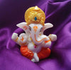 Handmade Lord Ganesh idol for car dashboard and home decor, crafted from resin, measuring 9.4L x 8.4W x 9.6H cm, symbolizing wisdom and prosperity