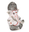 Handmade Lord Ganesh idol for car dashboard, crafted from marble, measuring 5.1L x 5.1W x 7.6H cm, symbolizing wisdom and prosperity.