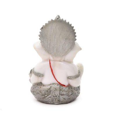 Handmade Lord Ganesh idol for car dashboard, crafted from marble, measuring 5.1L x 5.1W x 7.6H cm, symbolizing wisdom and prosperity