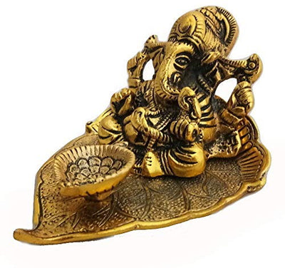 Handmade Lord Ganesh idol crafted from metal, measuring 10.2L x 10.2W x 7.6H cm, serving as a beautiful showpiece for home decor.