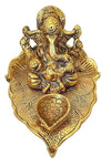 Handmade Lord Ganesh idol crafted from metal, measuring 10.2L x 10.2W x 7.6H cm, serving as a beautiful showpiece for home decor.