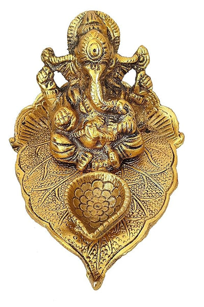 Handmade Lord Ganesh idol crafted from metal, measuring 10.2L x 10.2W x 7.6H cm, serving as a beautiful showpiece for home decor.