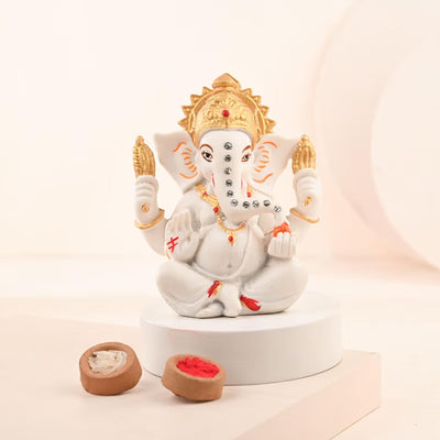 Handmade Lord Ganesh idol showpiece for home decor, crafted from resin, measuring 15L x 12W x 10H cm, symbolizing wisdom and prosperity