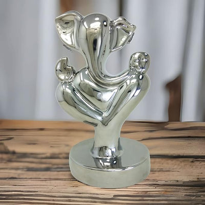 Handmade Lord Ganesh idol crafted from resin, measuring 9L x 9W x 15H cm, symbolizing wisdom and prosperity for home decor.