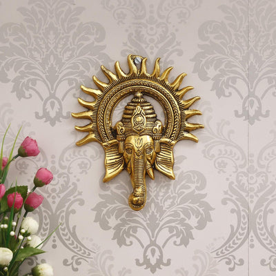 Handmade Lord Ganesh idol wall hanging, crafted from metal, measuring 20L x 2.5W x 24H cm, symbolizing wisdom and prosperity for home decor.
