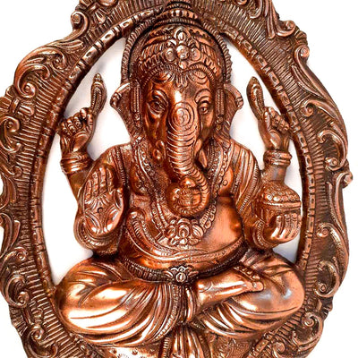 Handmade Lord Ganesh idol wall hanging, crafted from metal, featuring intricate details, measuring 28L x 5W x 40H cm, perfect for home decor