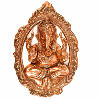 Handmade Lord Ganesh idol wall hanging, crafted from metal, featuring intricate details, measuring 28L x 5W x 40H cm, perfect for home decor