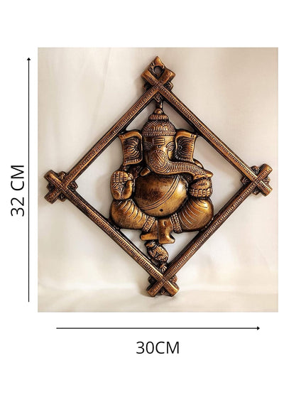 Handmade Lord Ganesh idol wall hanging, crafted from metal, featuring intricate details, measuring 30L x 2W x 32H cm, ideal for altars.