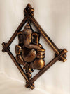 Handmade Lord Ganesh idol wall hanging, crafted from metal, featuring intricate details, measuring 30L x 2W x 32H cm, ideal for altars.