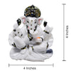 A beautifully crafted white marble idol of Lord Ganesha, symbolizing blessings and prosperity, suitable for car dashboards and home decor.