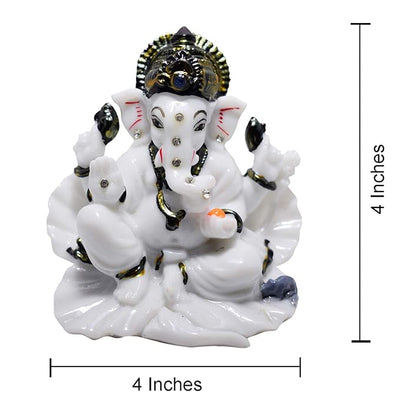 A beautifully crafted white marble idol of Lord Ganesha, symbolizing blessings and prosperity, suitable for car dashboards and home decor.