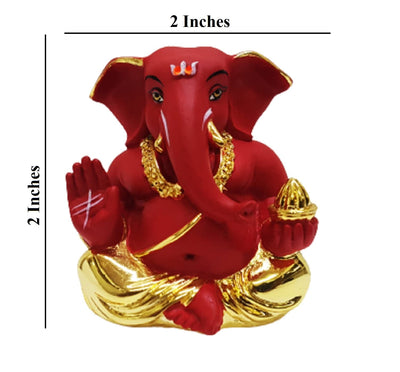 Handmade resin statue of Lord Ganesha, measuring 5.1 x 5.1 x 5.1 cm, featuring a gold-plated finish and red terracotta accents.