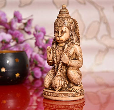 Handcrafted Lord Hanuman Ji idol made from synthetic material, featuring intricate carvings and a soothing beige color, ideal for spiritual spaces.