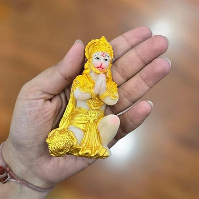 Handmade Lord Hanuman Ji idol in golden polyresin, ideal for altars and puja mandirs, showcasing intricate details and divine presence.