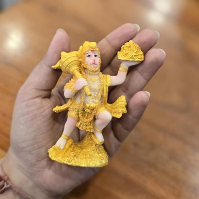 Handmade Lord Hanuman Ji idol in golden synthetic resin, ideal for altar decoration and invoking blessings.