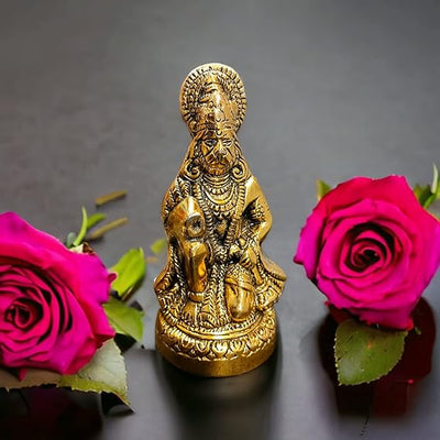 "Handmade metal statue of Lord Hanuman with a golden finish, symbolizing strength and devotion, suitable for home or office decor."