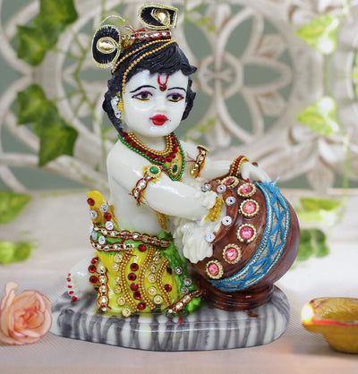 Handmade Lord Krishna resin statue depicting the mischievous cowherd, ideal for home decor, altars, and spiritual spaces.