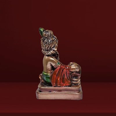 Handmade brass Lord Krishna Makhan Chor idol, depicting the playful deity stealing butter, ideal for altars and spiritual spaces.