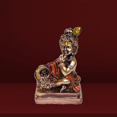 Handmade brass Lord Krishna Makhan Chor idol, depicting the playful deity stealing butter, ideal for altars and spiritual spaces.