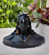 Handcrafted Lord Shiva idol in a serene meditative pose, made from durable aluminum, ideal for home altars and spiritual decor.