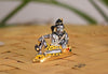 Handmade Lord Shiva idol in a meditative pose, crafted from metal, ideal for home altars and spiritual decor.