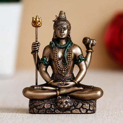 Hand-carved Lord Shiva statue in a meditative pose, crafted from solid cold cast bronze, ideal for enhancing spiritual spaces.