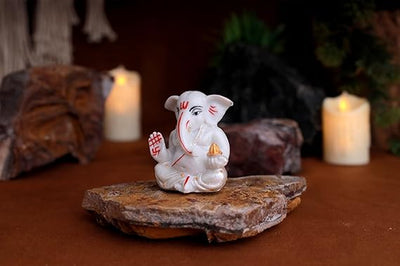 Handmade silver-plated Lord Ganesha idol crafted from resin, symbolizing prosperity and success. Ideal for home, office, or altar decor.