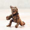 Handmade copper statue of Lord Hanuman, showcasing intricate details and craftsmanship, ideal for altars or decorative purposes.