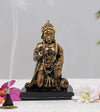 Handmade Lord Hanuman polyresin statue in a serene seated posture, symbolizing strength and protection, ideal for altars and spiritual spaces.