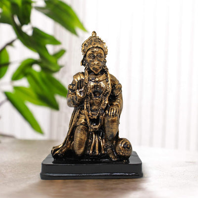 Handmade Lord Hanuman polyresin statue in a serene seated posture, symbolizing strength and protection, ideal for altars and spiritual spaces.