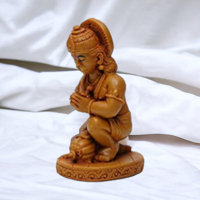 Handmade resin idol of Lord Hanuman, featuring a serene design, ideal for home altar or decor, symbolizing protection and devotion in Hinduism.