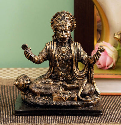 Handmade Lord Hanuman polyresin idol in a seated posture, symbolizing strength and protection, ideal for altars and spiritual home decor.