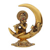 Handcrafted golden metal Lord Krishna idol, depicting him playing the flute on a half moon, showcasing intricate details and elegance.