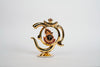 OM-shaped Lord Krishna idol in metal with intricate details and a gold-plated finish, ideal for enhancing spiritual spaces.