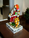 Handmade Maa Durga idol sculpture seated on a tiger, crafted from high-quality resin with vibrant colors, ideal for worship and home decor.