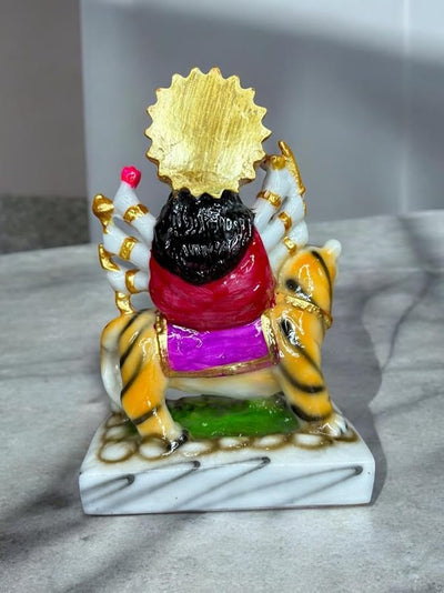 Handmade Maa Durga idol sculpture seated on a tiger, crafted from high-quality resin with vibrant colors, ideal for worship and home decor