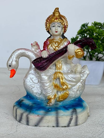 Handcrafted Marble Dust Saraswati idol, showcasing intricate details and serene beauty, symbolizing wisdom and knowledge.