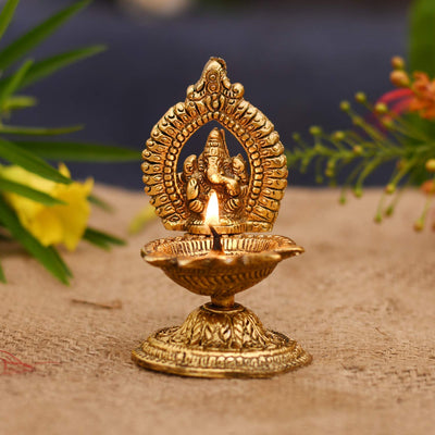 Handmade metal Ganesha idol, ideal for home temple decoration or as a gift. Dimensions: 5.1L x 5.1W x 11.4H cm, 250 grams