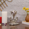 Handmade metal Ganesha idol, ideal for pooja room or as a collectible. Dimensions: 14L x 8.9W x 19.1H cm, 350 grams