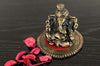 Intricately crafted metal Lord Ganesha statue on a round base, symbolizing wisdom and prosperity, perfect for home decor
