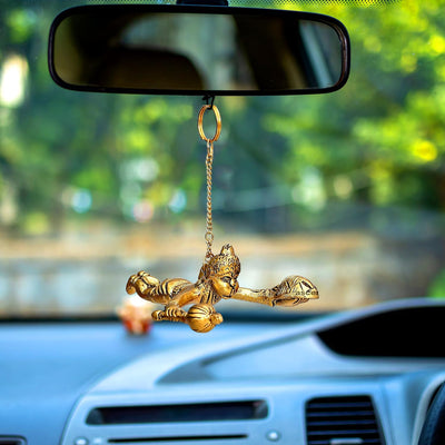 Handmade metal flying Hanuman idol in a dynamic pose, symbolizing strength and devotion, suitable for car mirror, altar, or home decor.
