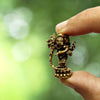 "Handcrafted mini brass Ganesha collectible idol, measuring 1.78 cm x 1.27 cm x 3.05 cm, perfect for altars, decor, and gifting blessings."