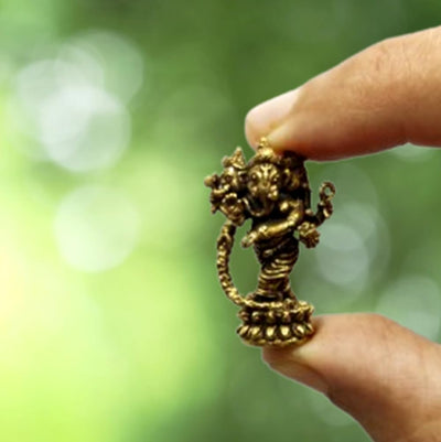 "Handcrafted mini brass Ganesha collectible idol, measuring 1.78 cm x 1.27 cm x 3.05 cm, perfect for altars, decor, and gifting blessings."