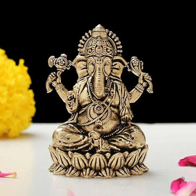 Handcrafted mini brass Ganesha idol, 3 x 2 W x 5 H cm, 150g, symbolizing wisdom and prosperity. Ideal for home, office, car decor, or gifting.