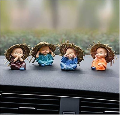 Collection of four miniature Buddha monk statues made from durable resin, ideal for indoor and outdoor decor, promoting tranquility and mindfulness