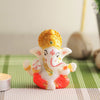 Handcrafted Mukut Ganesh idol in ceramic, adorned with a regal crown, symbolizing blessings and spirituality, ideal for altars and decor.