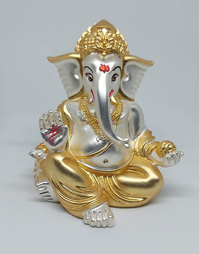 A beautifully handcrafted Lord Ganesha idol, featuring intricate details and a two-tone matte finish, perfect for home decor or car dashboards.