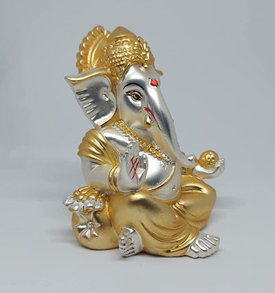 A beautifully handcrafted Lord Ganesha idol, featuring intricate details and a two-tone matte finish, perfect for home decor or car dashboards.